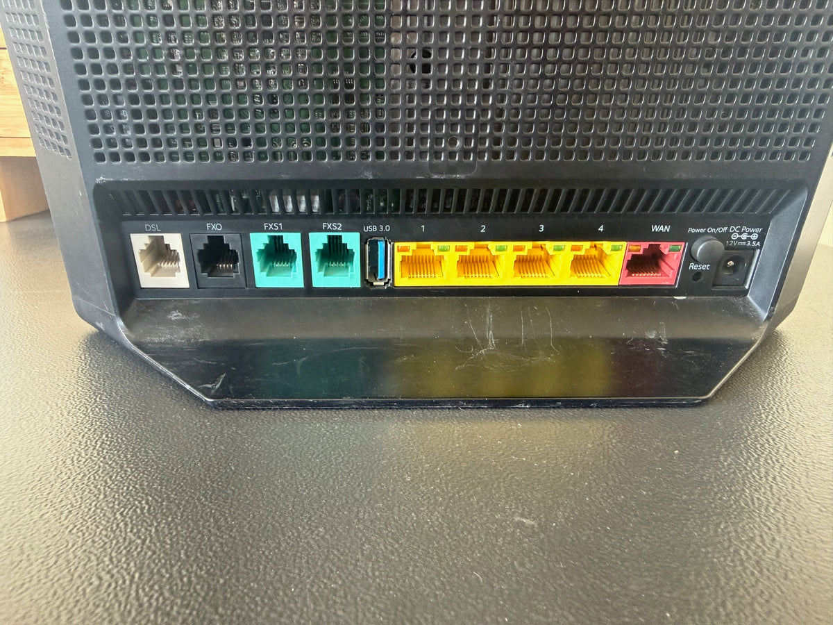 Actual Netgear V7610 rear ports including DSL, phone, USB 3.0, four LAN ports and WAN