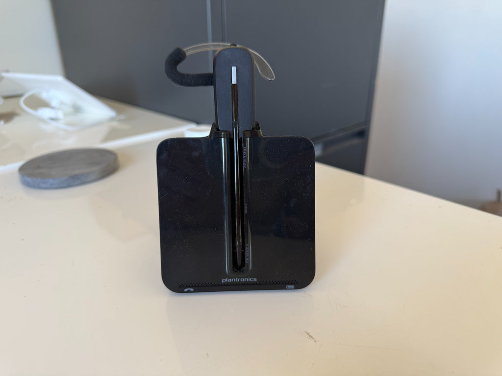 Used Plantronics wireless headset with C054A charging base, actual stock example