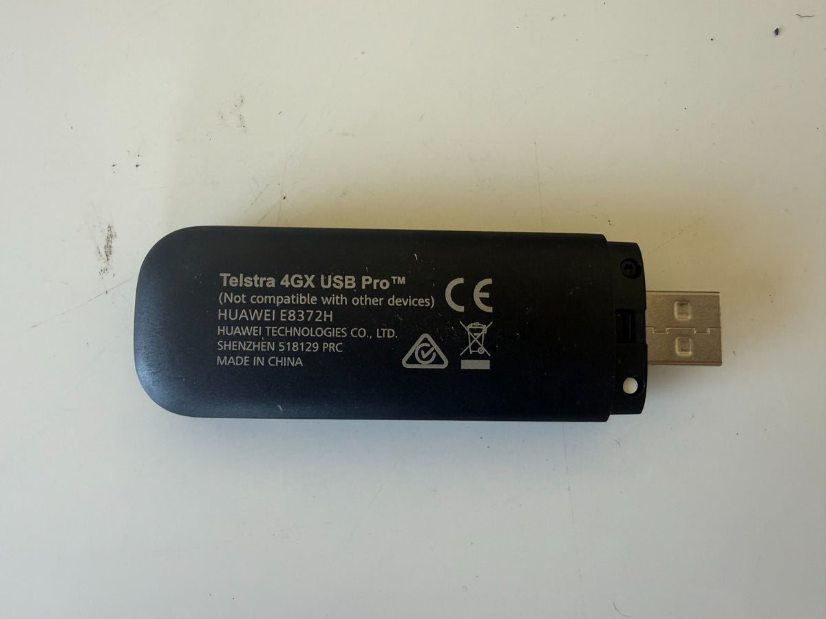 Actual Telstra 4GX USB Pro Huawei E8372H rear label with device compatibility warning